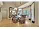 Elegant dining room features a chandelier, a mirrored wall, and lots of natural light at 104 Hidden Springs Ln, Peachtree City, GA 30269