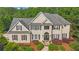 Charming home with inviting entryway, well-maintained landscaping, and classic architectural details at 104 Hidden Springs Ln, Peachtree City, GA 30269