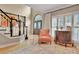 Charming foyer with an arched window, hardwood floors, and elegant furnishings creating a warm and inviting atmosphere at 104 Hidden Springs Ln, Peachtree City, GA 30269