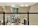 Foyer with high ceilings and railing looking down on the living room and fireplace at 104 Hidden Springs Ln, Peachtree City, GA 30269