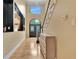 Inviting foyer with grand staircase, arched doorway, and stylish decor at 104 Hidden Springs Ln, Peachtree City, GA 30269