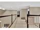 Upstairs hallway with carpet flooring and access to bedrooms and office at 104 Hidden Springs Ln, Peachtree City, GA 30269
