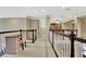 Upstairs hallway with a desk space and nice railing at 104 Hidden Springs Ln, Peachtree City, GA 30269