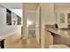 Hallway view showing the kitchen area and access to another floor at 104 Hidden Springs Ln, Peachtree City, GA 30269