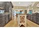 Open-concept kitchen featuring stainless appliances, custom cabinetry, island, and adjoining breakfast area at 104 Hidden Springs Ln, Peachtree City, GA 30269