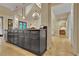 Modern kitchen boasts granite countertops and a view through to the living area and bedrooms at 104 Hidden Springs Ln, Peachtree City, GA 30269