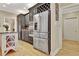 Gourmet kitchen features stainless appliances, custom cabinetry, and central kitchen island with storage at 104 Hidden Springs Ln, Peachtree City, GA 30269
