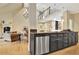 Open kitchen with stainless appliances and granite counters, flows into the living room area at 104 Hidden Springs Ln, Peachtree City, GA 30269
