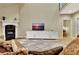 Inviting living room with fireplace, tv, and stylish decor, creating a welcoming ambiance at 104 Hidden Springs Ln, Peachtree City, GA 30269