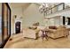 Comfortable living room with a fireplace, seating area and hardwood floors at 104 Hidden Springs Ln, Peachtree City, GA 30269