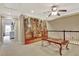 Spacious loft area with large artwork and comfortable seating near stairs at 104 Hidden Springs Ln, Peachtree City, GA 30269