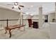 Open loft space with desk, railing, and stairs to another level at 104 Hidden Springs Ln, Peachtree City, GA 30269