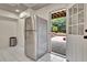 Stainless steel refrigerator and view to outside patio area at 104 Hidden Springs Ln, Peachtree City, GA 30269