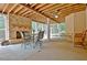 Covered patio with an exposed ceiling and fireplace at 104 Hidden Springs Ln, Peachtree City, GA 30269