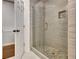 Walk-in shower features stone detailing and a tiled bench and built in storage at 104 Hidden Springs Ln, Peachtree City, GA 30269