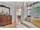 Bright sitting area with dresser, comfortable sofa and access to screened-in porch at 104 Hidden Springs Ln, Peachtree City, GA 30269