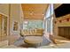 Spacious screened in porch with fireplace, ample seating and backyard views at 104 Hidden Springs Ln, Peachtree City, GA 30269