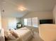 Bright bedroom features a work space, a queen bed and a large window at 2757 Malton Way, Loganville, GA 30052