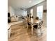 Open floor plan with dining area flowing into a living space with abundant natural light at 2757 Malton Way, Loganville, GA 30052