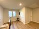 Bright hallway features wood-look floors, a window, and neutral paint at 2757 Malton Way, Loganville, GA 30052