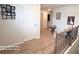 Upstairs hallway featuring wood floors and decorative Gathering photos at 2757 Malton Way, Loganville, GA 30052