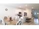 Bright kitchen and dining area with modern appliances and white cabinetry at 2757 Malton Way, Loganville, GA 30052