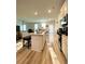 Modern kitchen with stainless appliances, center island and view into living room at 2757 Malton Way, Loganville, GA 30052