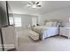 A spacious main bedroom offers carpet, a large bed, and white furnishings at 2757 Malton Way, Loganville, GA 30052