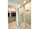 The bathroom features a glass enclosed shower adjacent to an opening for a walk in closet at 2757 Malton Way, Loganville, GA 30052