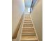 Stairway featuring wood treads and risers under a window for natural light at 2757 Malton Way, Loganville, GA 30052