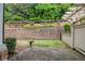 Well-maintained backyard with a retaining wall, offering privacy and a serene outdoor space at 2855 Middlecreek Way # 2855, Cumming, GA 30041