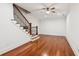 Spacious basement area with hardwood floors, a staircase with iron railings, and ample natural light at 2855 Middlecreek Way # 2855, Cumming, GA 30041