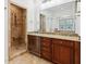 Bathroom boasts granite countertops, tile flooring, a glass shower, and elegant fixtures at 2855 Middlecreek Way # 2855, Cumming, GA 30041
