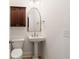 Classic powder room featuring a pedestal sink and decorative mirror at 2855 Middlecreek Way # 2855, Cumming, GA 30041