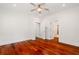 Spacious bedroom with hardwood floors, walk-in closet, and access to an ensuite bathroom at 2855 Middlecreek Way # 2855, Cumming, GA 30041