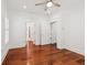 Bedroom with hardwood floors, white walls, multiple closets, and ample natural light at 2855 Middlecreek Way # 2855, Cumming, GA 30041