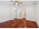This bedroom features hardwood floors, white trim, closet, and ensuite bathroom access at 2855 Middlecreek Way # 2855, Cumming, GA 30041