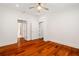 Bedroom boasts hardwood floors, a ceiling fan, and direct access to the closet at 2855 Middlecreek Way # 2855, Cumming, GA 30041