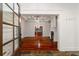 Elegant entryway featuring hardwood floors, detailed trim, fireplace, and an open view to the kitchen at 2855 Middlecreek Way # 2855, Cumming, GA 30041