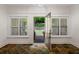 Bright entryway with decorative tile flooring, large windows with shutters, and an open door to the backyard at 2855 Middlecreek Way # 2855, Cumming, GA 30041