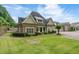 Charming single-Gathering home with a stone facade, manicured lawn, and an inviting entrance at 2855 Middlecreek Way # 2855, Cumming, GA 30041