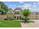 Charming home featuring stone accents, a lush lawn, and a three car garage at 2855 Middlecreek Way # 2855, Cumming, GA 30041