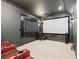 A large home theater room complete with speakers and a projection screen at 2855 Middlecreek Way # 2855, Cumming, GA 30041