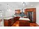 Kitchen with stainless steel appliances, wood cabinets, and granite countertops at 2855 Middlecreek Way # 2855, Cumming, GA 30041