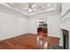 Spacious living room adjacent to a kitchen, featuring a fireplace at 2855 Middlecreek Way # 2855, Cumming, GA 30041