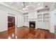 Cozy living room with fireplace, built-in shelving, and hardwood flooring at 2855 Middlecreek Way # 2855, Cumming, GA 30041