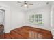 Bright office area with hardwood floors, white walls, ample natural light from windows with shutters at 2855 Middlecreek Way # 2855, Cumming, GA 30041