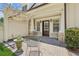 Inviting patio with pergola, decorative stone columns, and a garden view at 2855 Middlecreek Way # 2855, Cumming, GA 30041