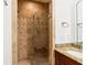 Modern tiled shower with a glass door and a built-in bench at 2855 Middlecreek Way # 2855, Cumming, GA 30041