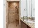 Modern bathroom features a neutral-toned tiled shower with a built-in bench, and granite countertops at 2855 Middlecreek Way # 2855, Cumming, GA 30041